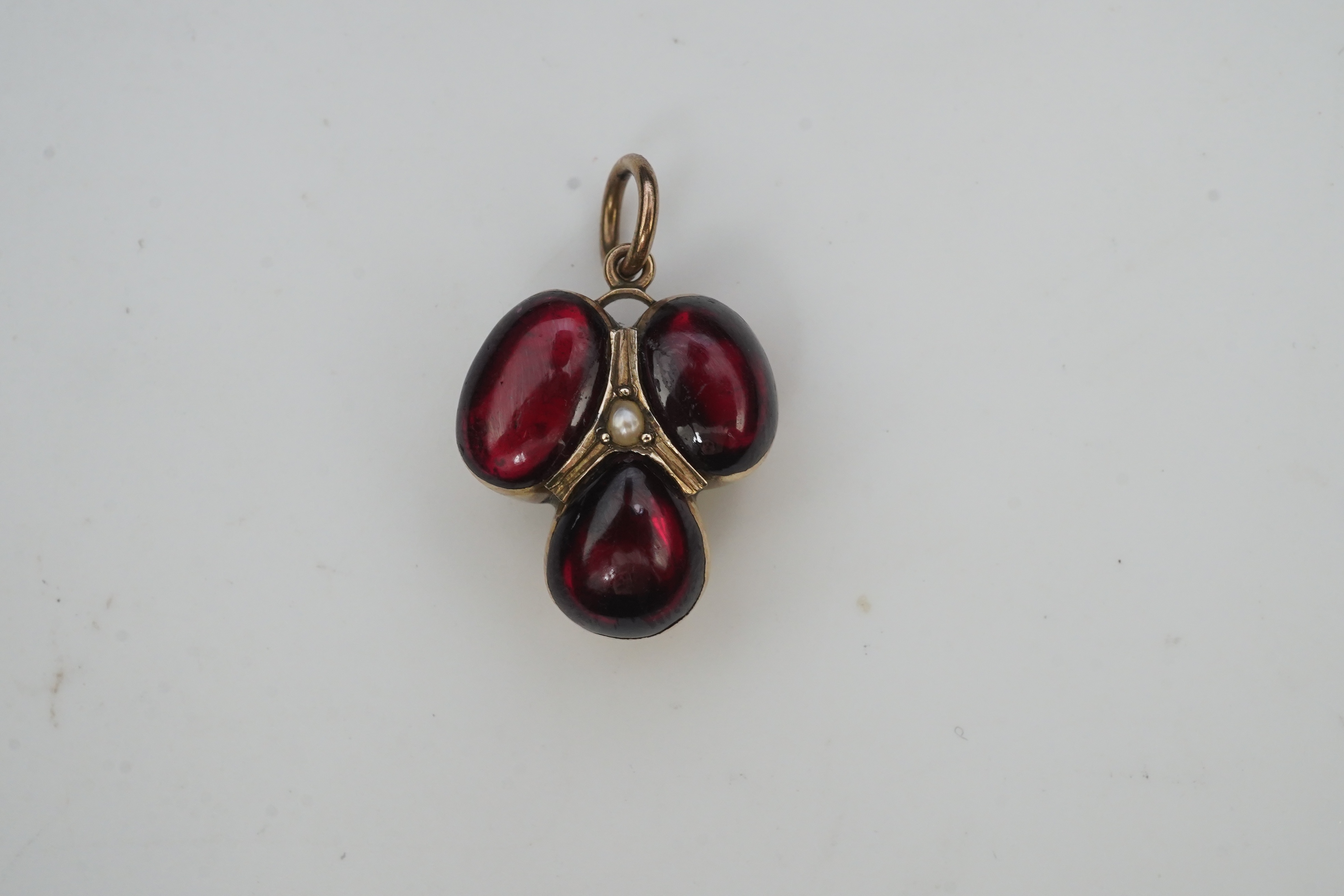 A Victorian garnet locket pendant, mid 19th century